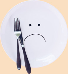 Plate with a sad smiley face